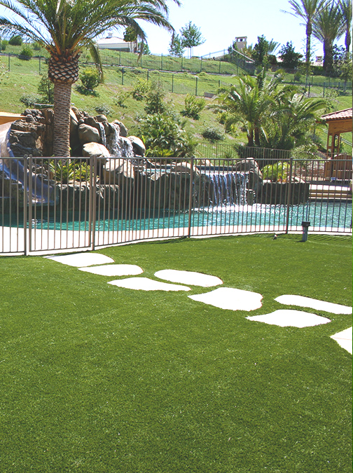 Synthetic Grass is Great Around Walkways and Pavers.